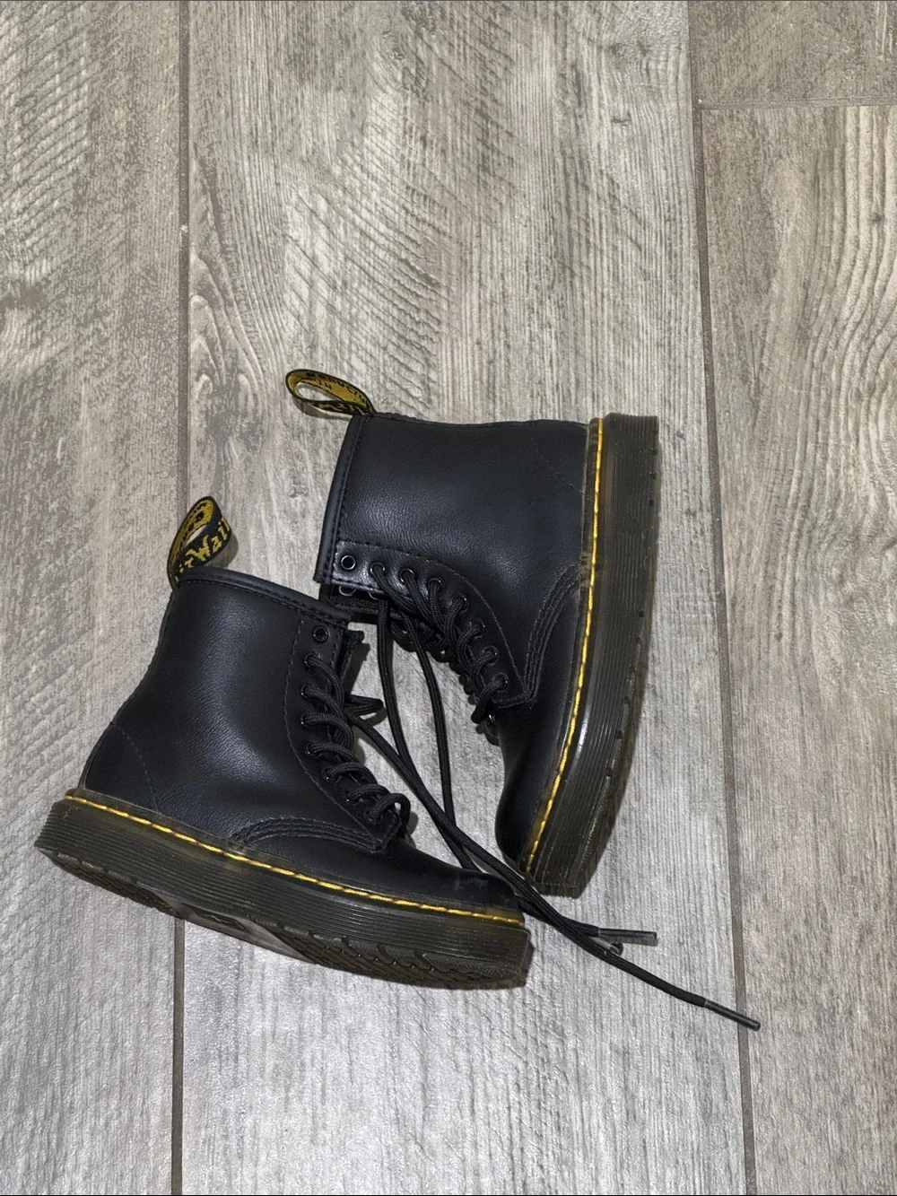 Dr. Martens Kids Black Lace-Up Boots with Yellow Stitching